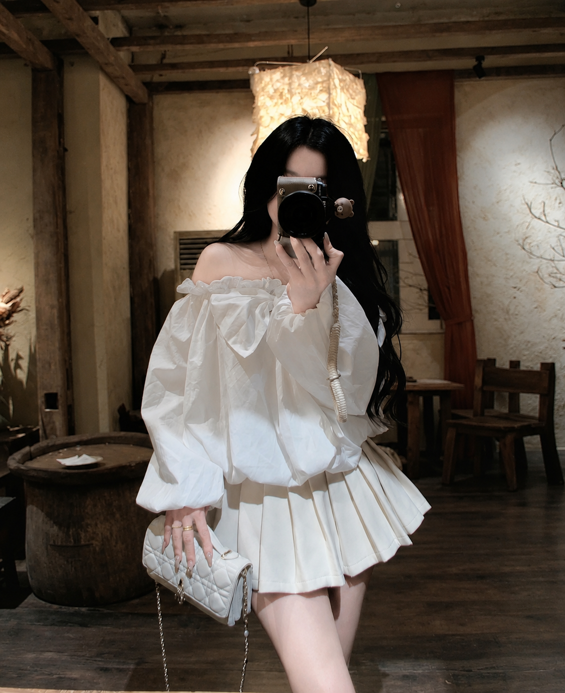 Off-The-Shoulder White Bubble Hem Blouse with Back Bow Detail