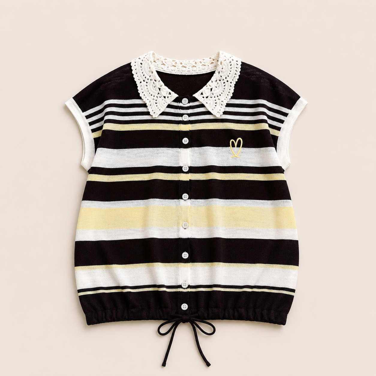 A short-sleeve knit top with horizontal black, white, and pale yellow stripes, featuring a white crochet collar, a button-up front, and a small yellow embroidered heart on the chest.