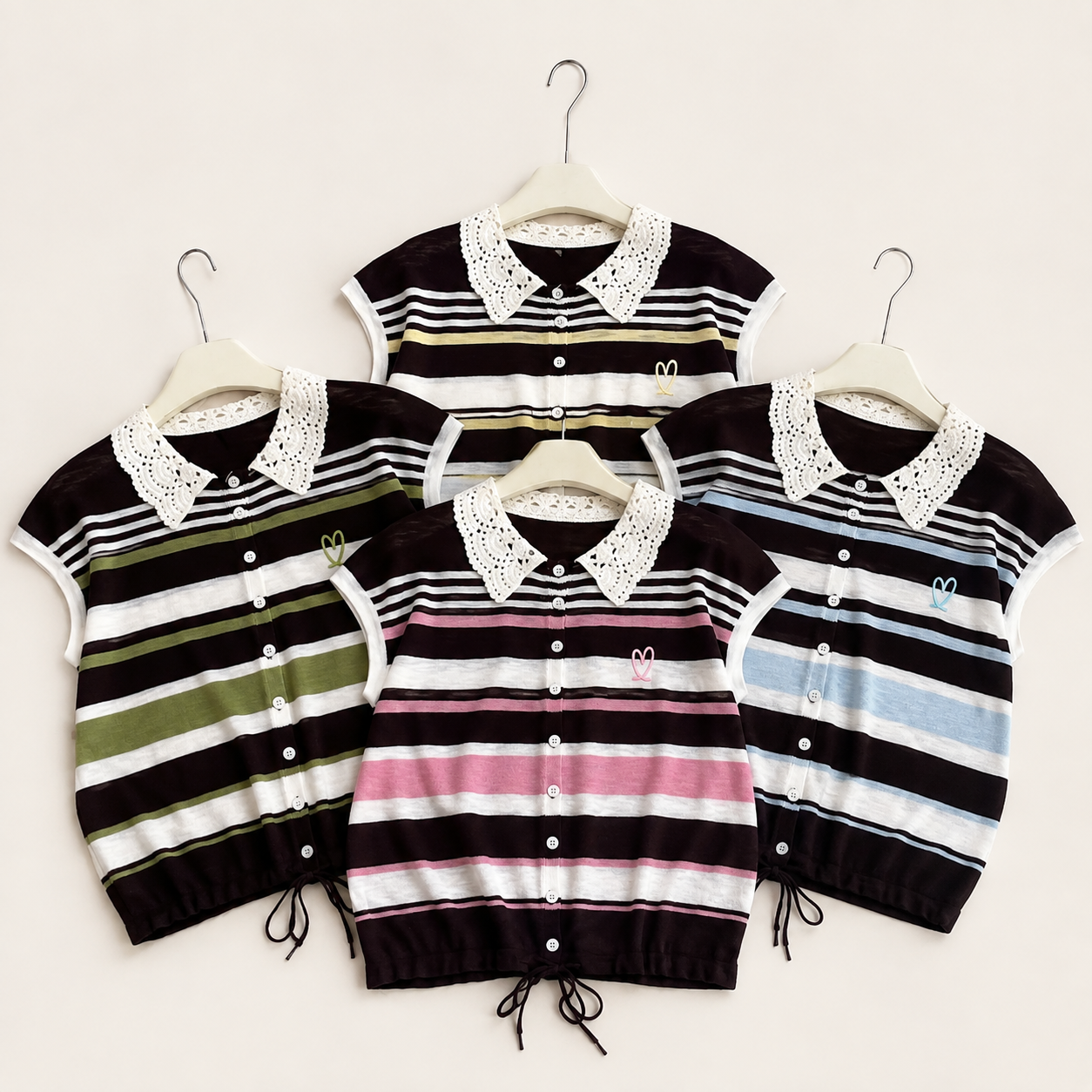 Four knit polo-style cardigans with striped patterns and white crochet collar details, displayed on hangers against a light beige background.